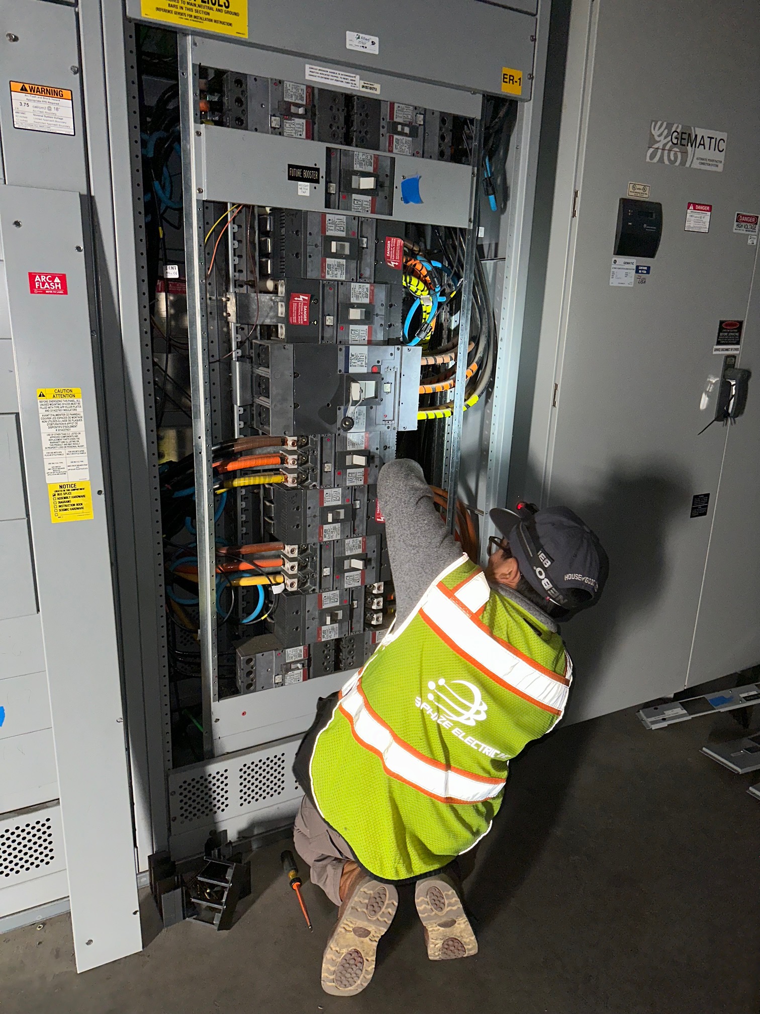 3 Phaze technician servicing GE Gematic distribution panel